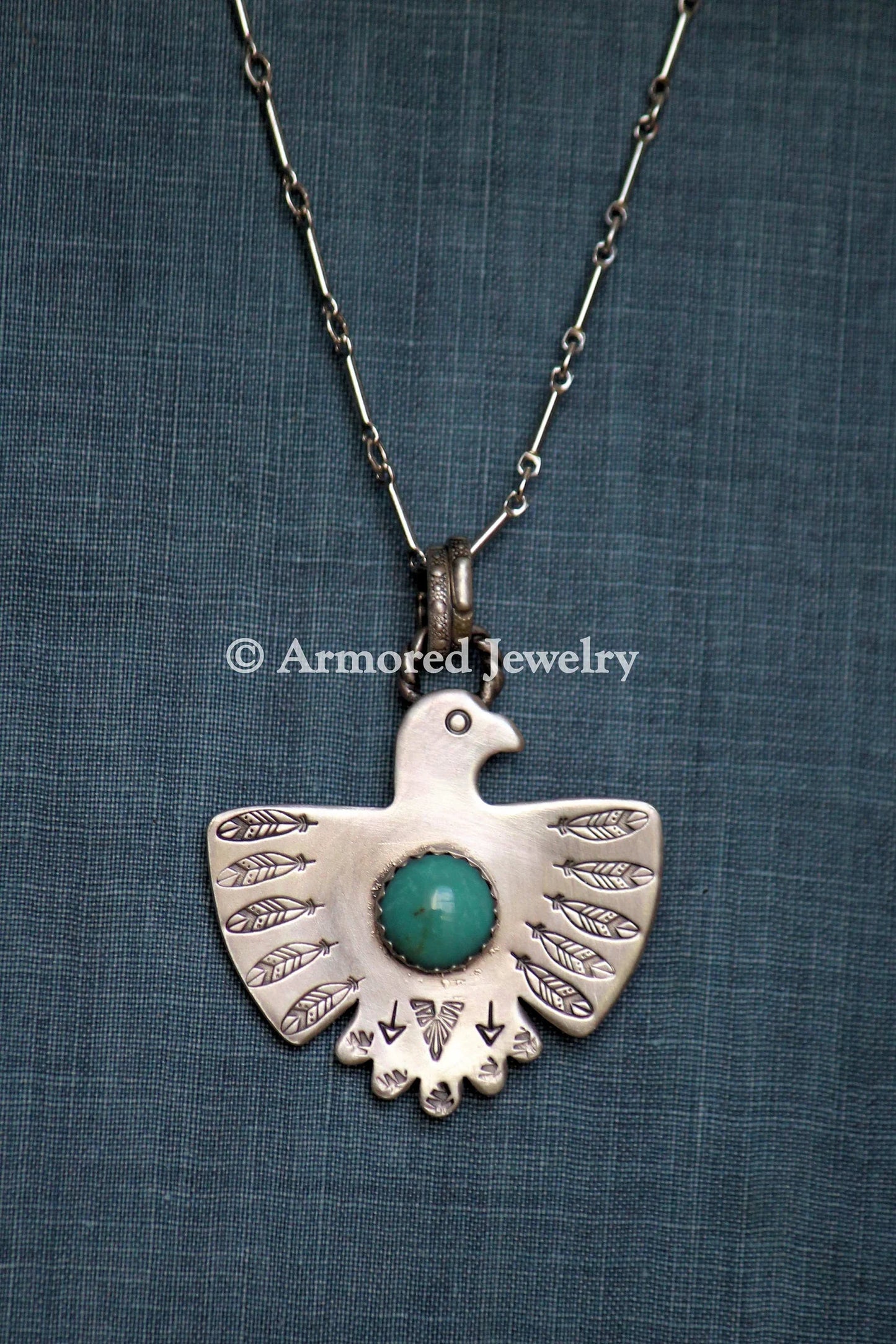 Sterling Silver Thunderbird Turquoise Necklace