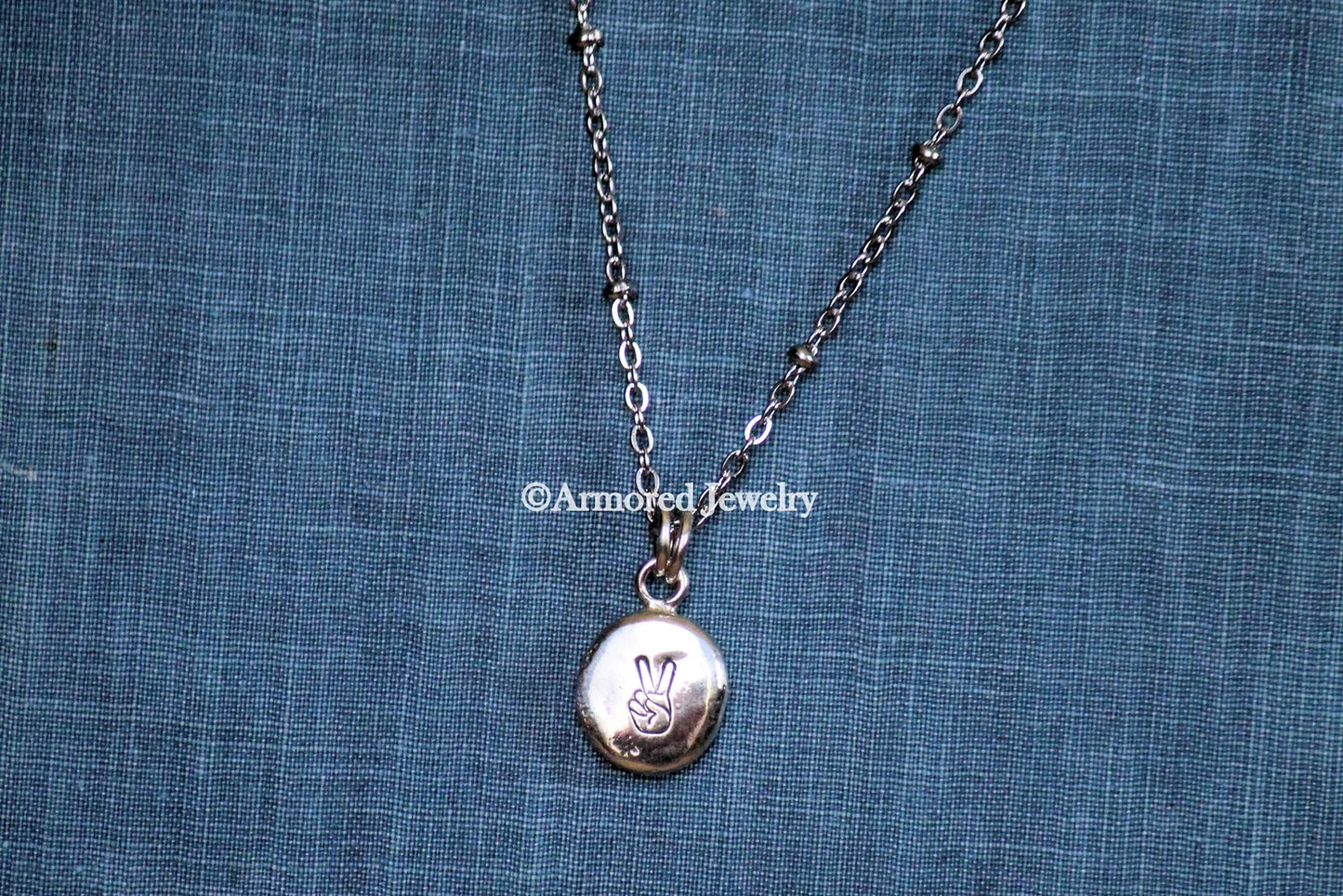 Sterling Silver Peace Stamped Pebble pendant necklace